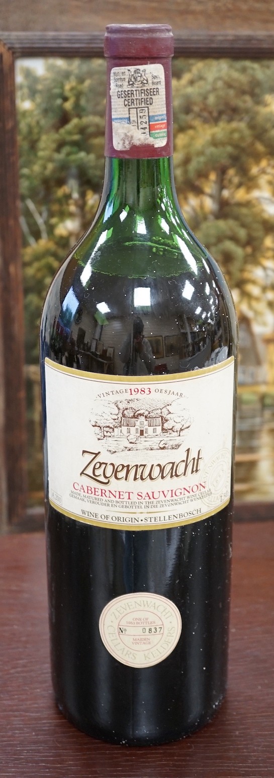 Eleven bottles of assorted wine, to include a magnum of limited edition maiden vintage 1983 Zevenwacht Cabernet Sauvignon, six bottles of 75cl 1976 Chateau de Pommard, and others, together with two bottles of port (13)
